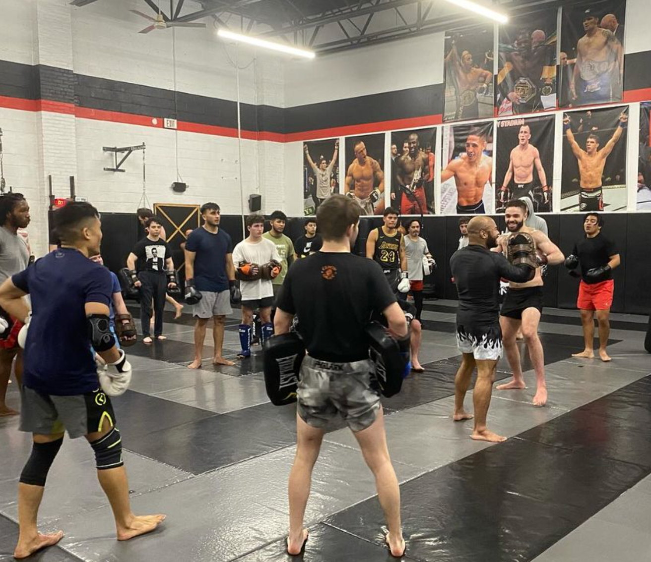 Students drilling Brazilian Jiu-Jitsu at Ray Longo's Mixed Martial Arts in Garden City, NY.