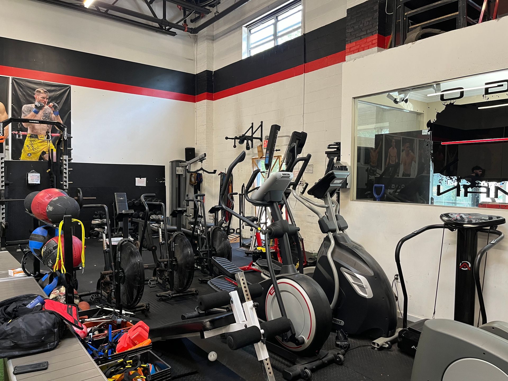 Adults training pads and grappling basics at Ray Longo's Mixed Martial Arts in Garden City, NY.