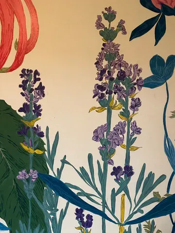 Floral wallpaper with lavender, blue, and red flower illustrations on a white background.