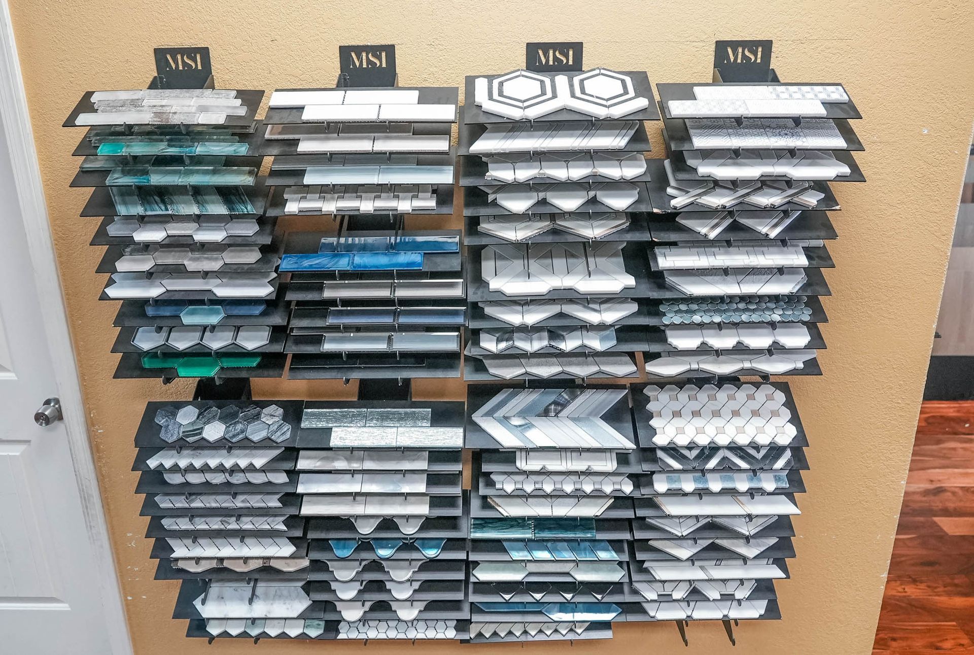 There are many different types of tiles on the shelves.