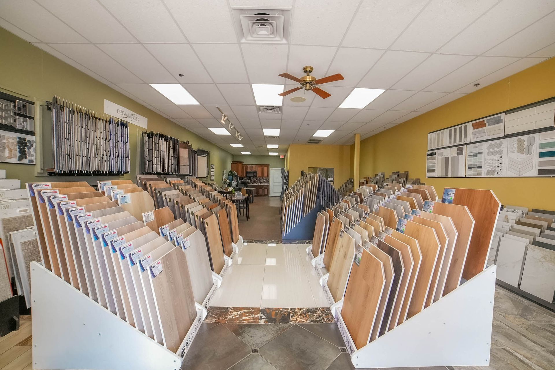 A store filled with lots of tiles and a ceiling fan.