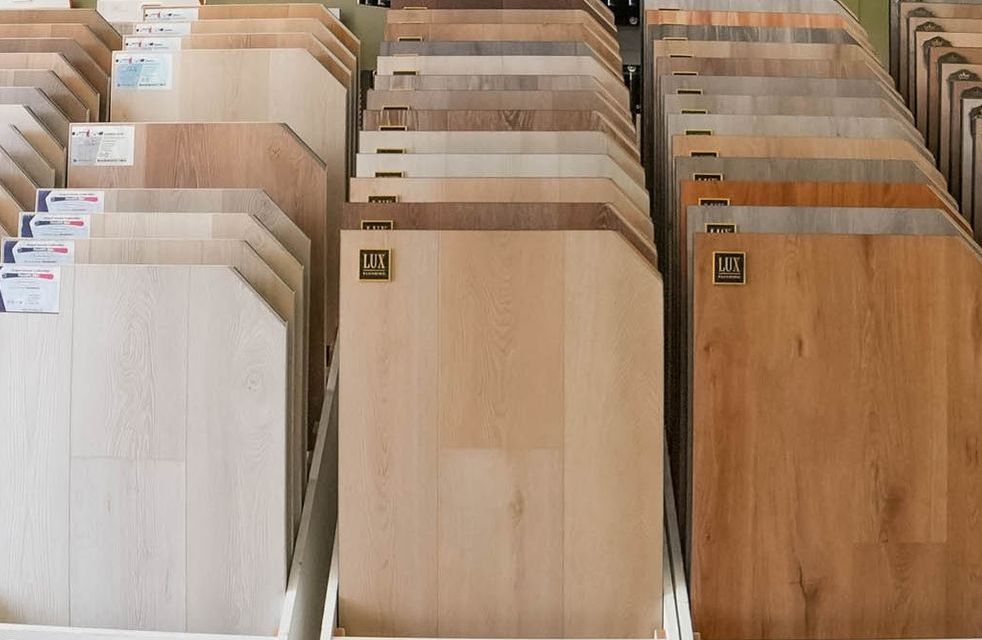 A display of different types of wooden flooring in a store.