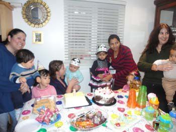 parents, children, & staff celebrating a birthday