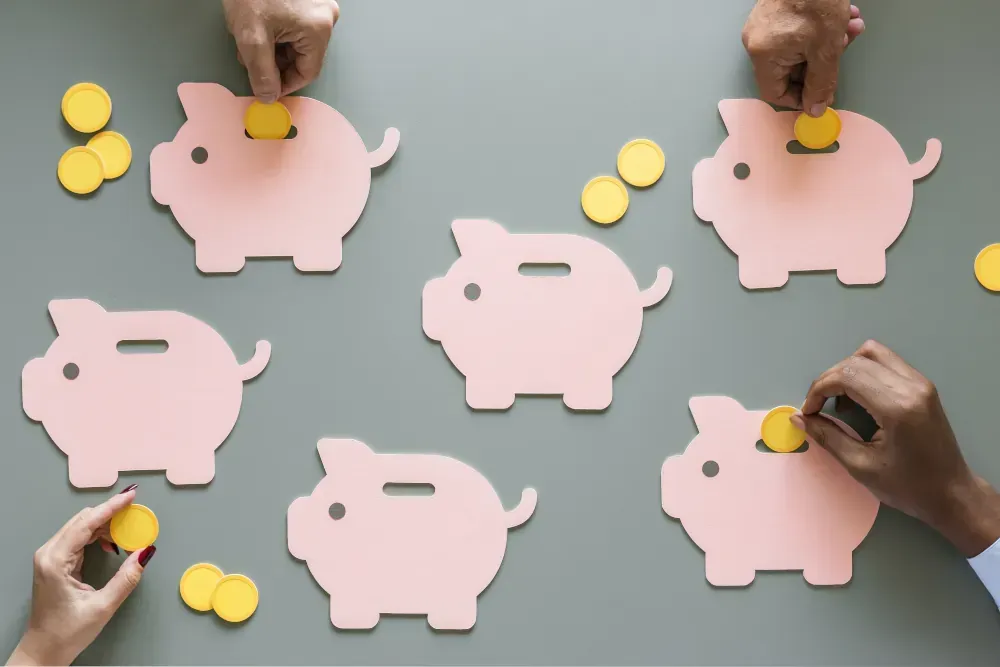 A group of people are putting coins into piggy banks.