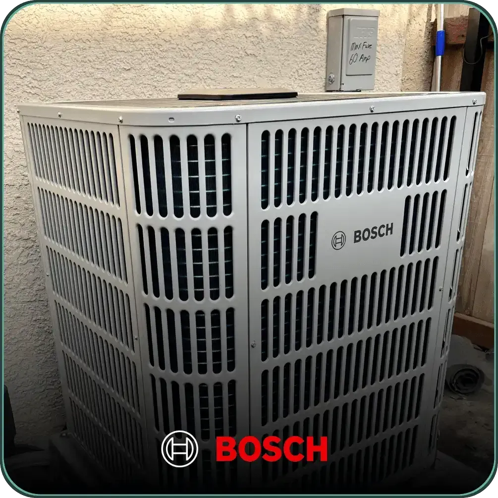A bosch air conditioner sits outside in front of a wall