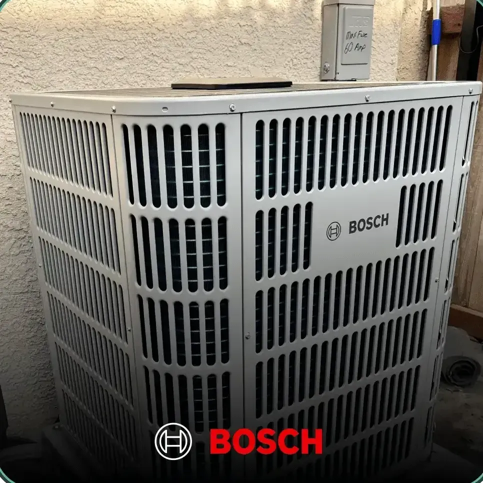 A bosch air conditioner is sitting in front of a wall.