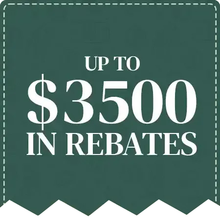 A green sign that says `` up to $ 3500 in rebates ''