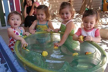 Beautiful Kids Playing Water — Overland Park, KS — Premier Learning