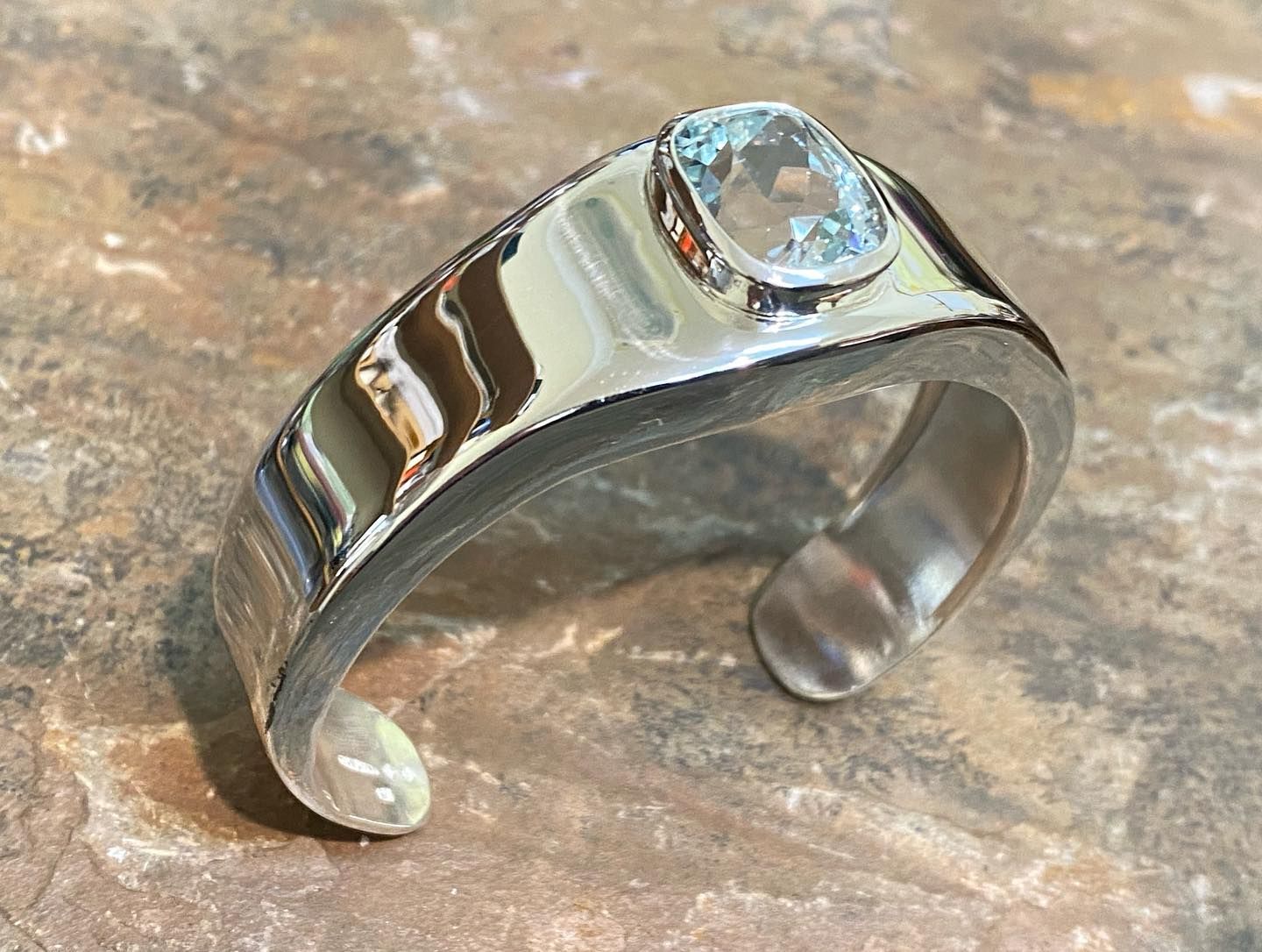 Silver Cuff Bracelet With Oval, Light Blue Gemstone Set — Burchell's Jewellers In Bowral, NSW