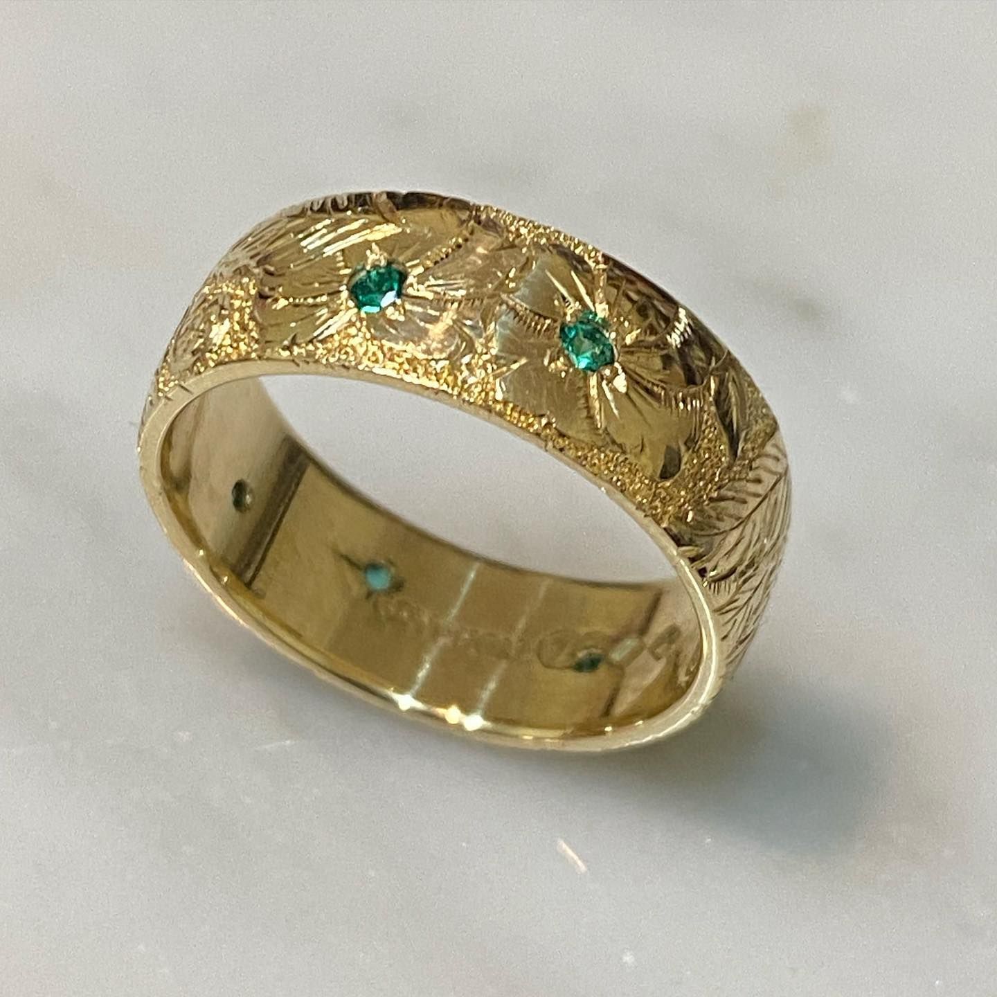 Gold Ring With Engraved Leaf Pattern And Small Emerald Accents — Burchell's Jewellers In Bowral, NSW