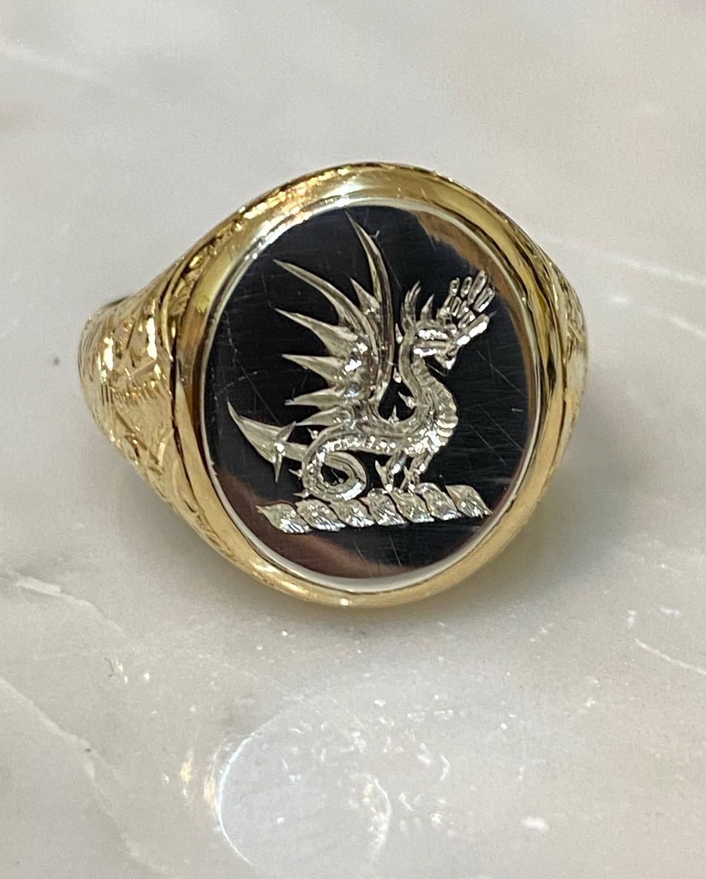 Gold Signet Ring With A Black Oval Face Featuring A Silver Dragon — Burchell's Jewellers In Bowral, NSW