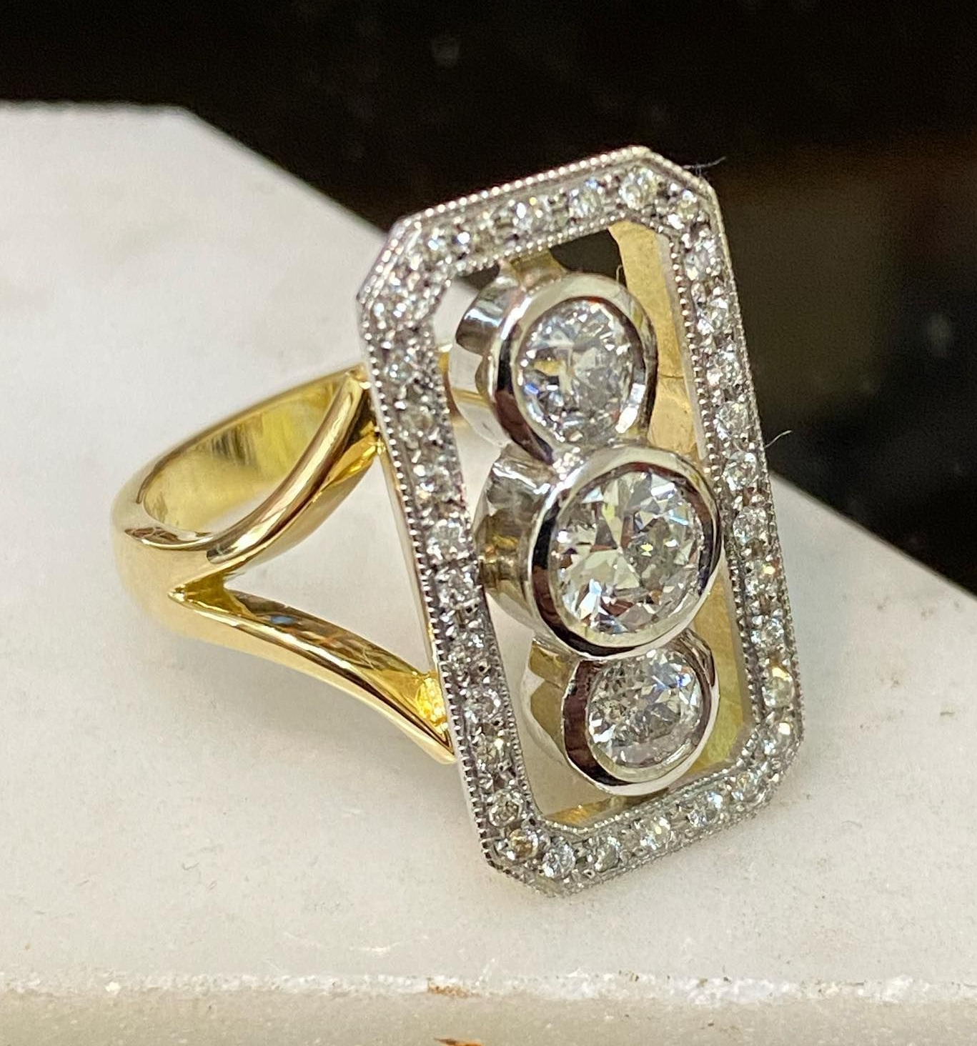 Diamond Ring With Intricate Geometric Design, Set on a Reflective Black Surface — Burchell's Jewellers In Bowral, NSW