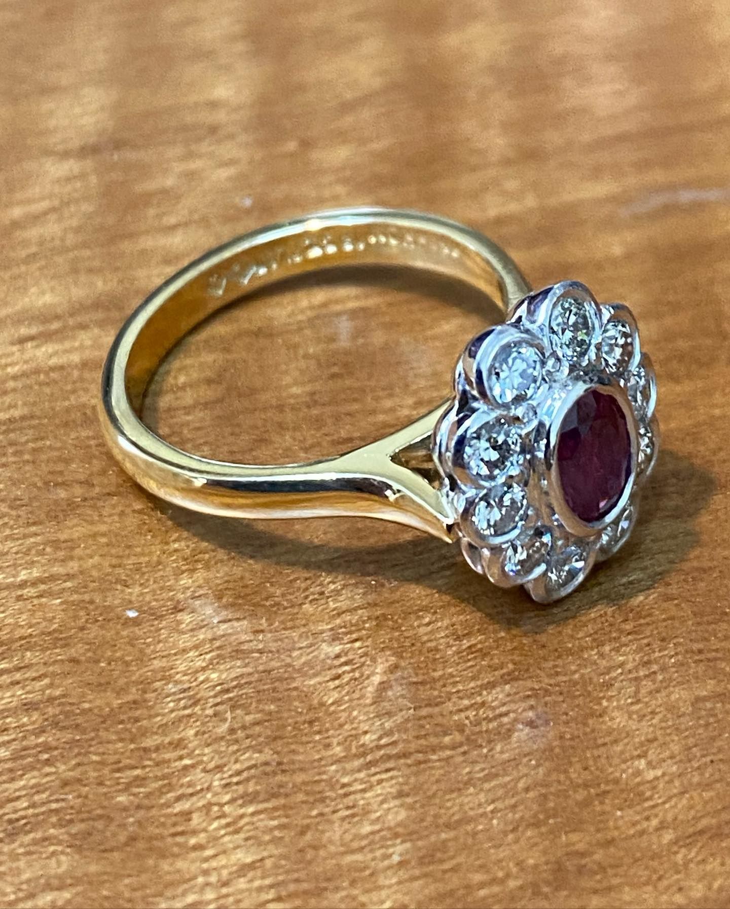 Gold Ring With A Red Gemstone Surrounded By Diamonds — Burchell's Jewellers In Bowral, NSW