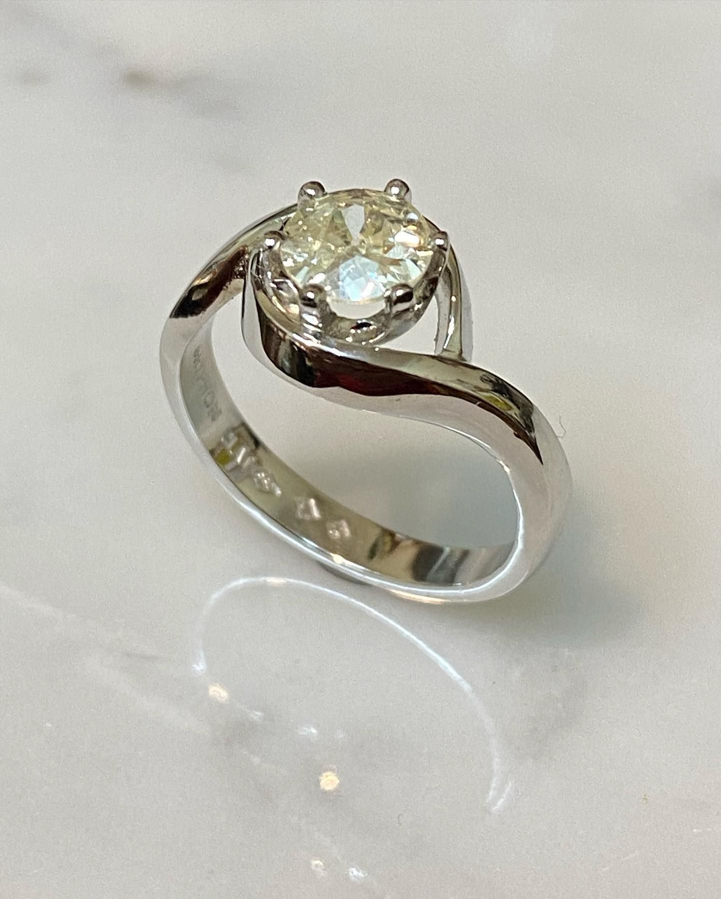 Solitaire Diamond Ring With Swirling White Gold Band — Burchell's Jewellers In Bowral, NSW