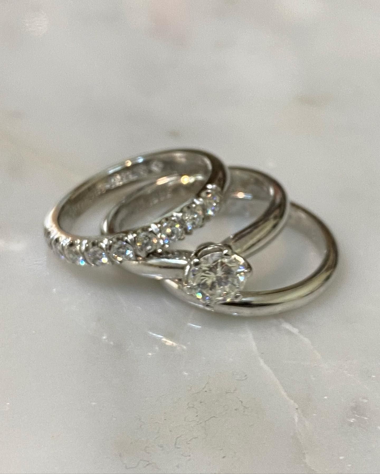 Three Diamond Rings On A Marble Surface — Burchell's Jewellers In Bowral, NSW