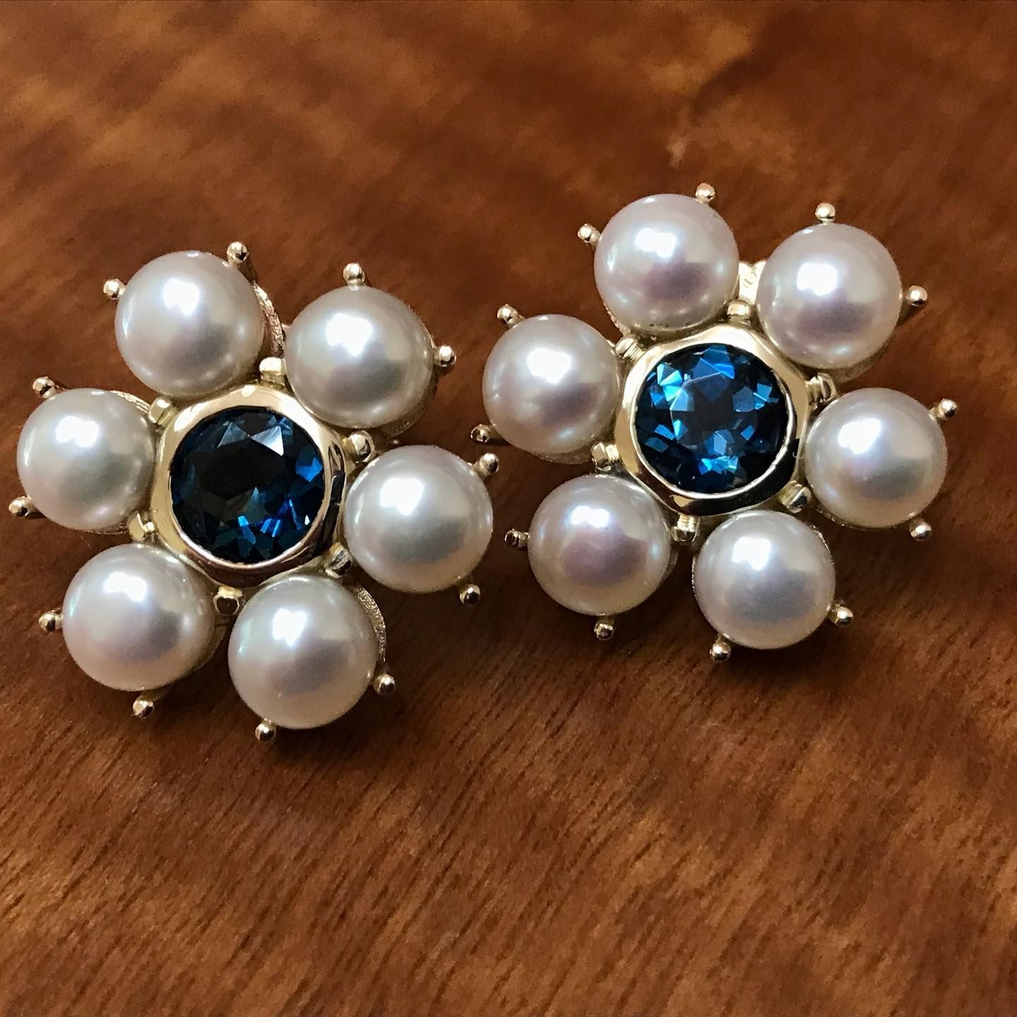 Pair of Gold Flower-shaped Earrings, Each With a Blue Gemstone Center — Burchell's Jewellers In Bowral, NSW