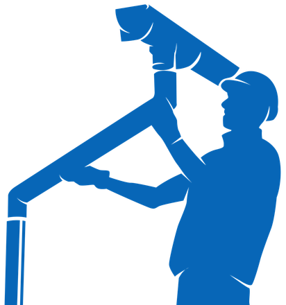Silhouette of a person in a cap assembling gutter pipes.