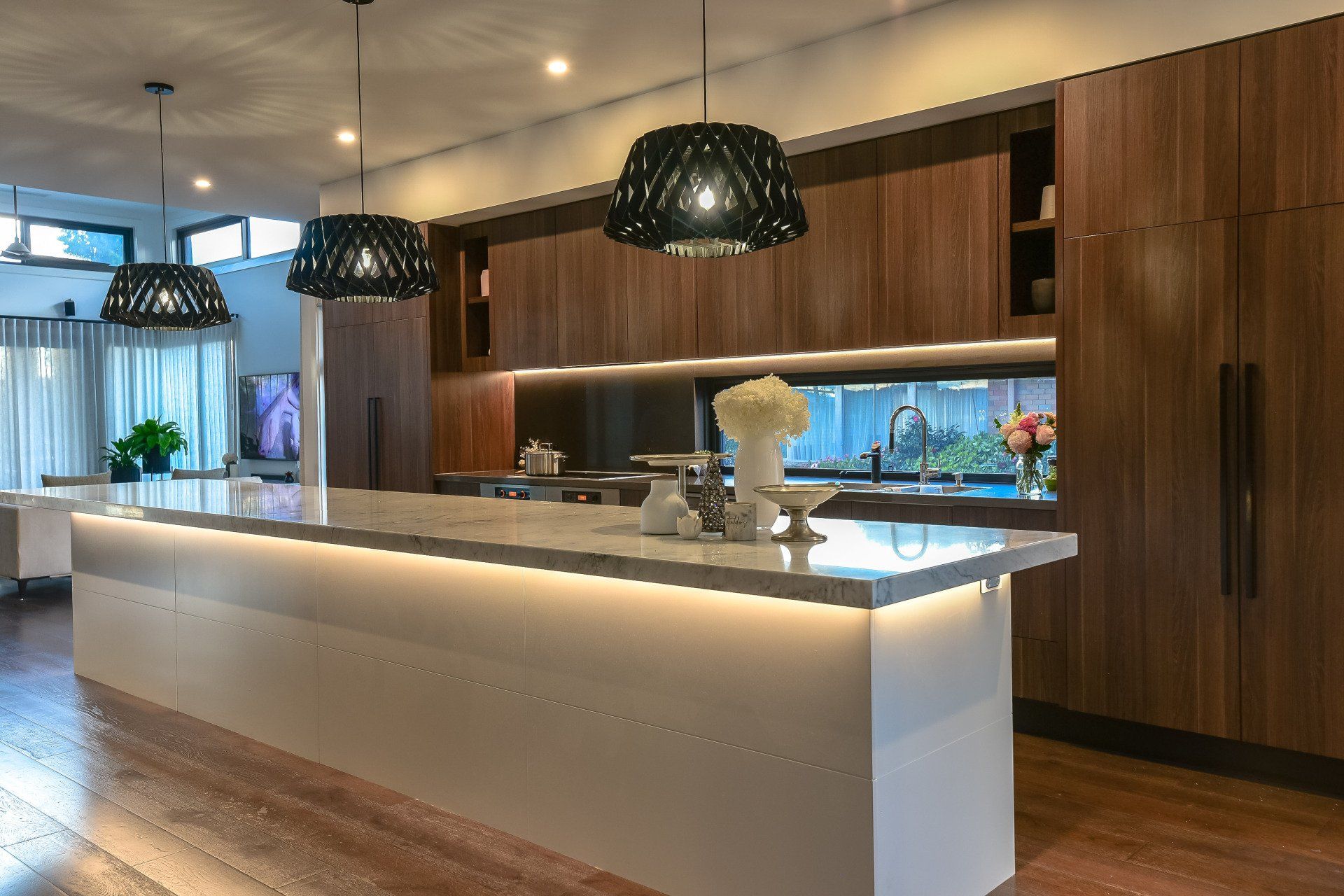 There is a large island in the middle of the kitchen.