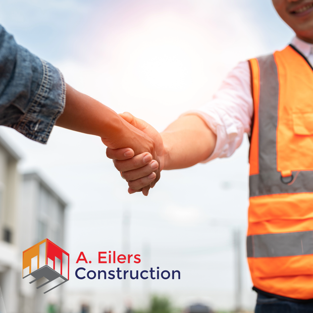 A person in a high-visibility orange vest shakes hands with another person, with the A. Eilers Construction logo visible.
