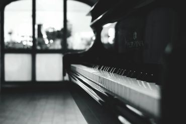 Grayscale Image of Baby Grand Piano — Summerfield, FL — Florida Piano Services. LLC