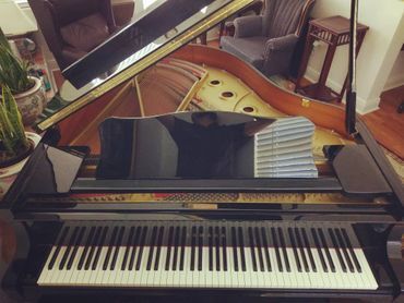 Front Black Baby Grand Piano — Summerfield, FL — Florida Piano Services. LLC