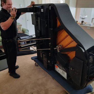 Lifting Baby Grand Piano — Summerfield, FL — Florida Piano Services. LLC