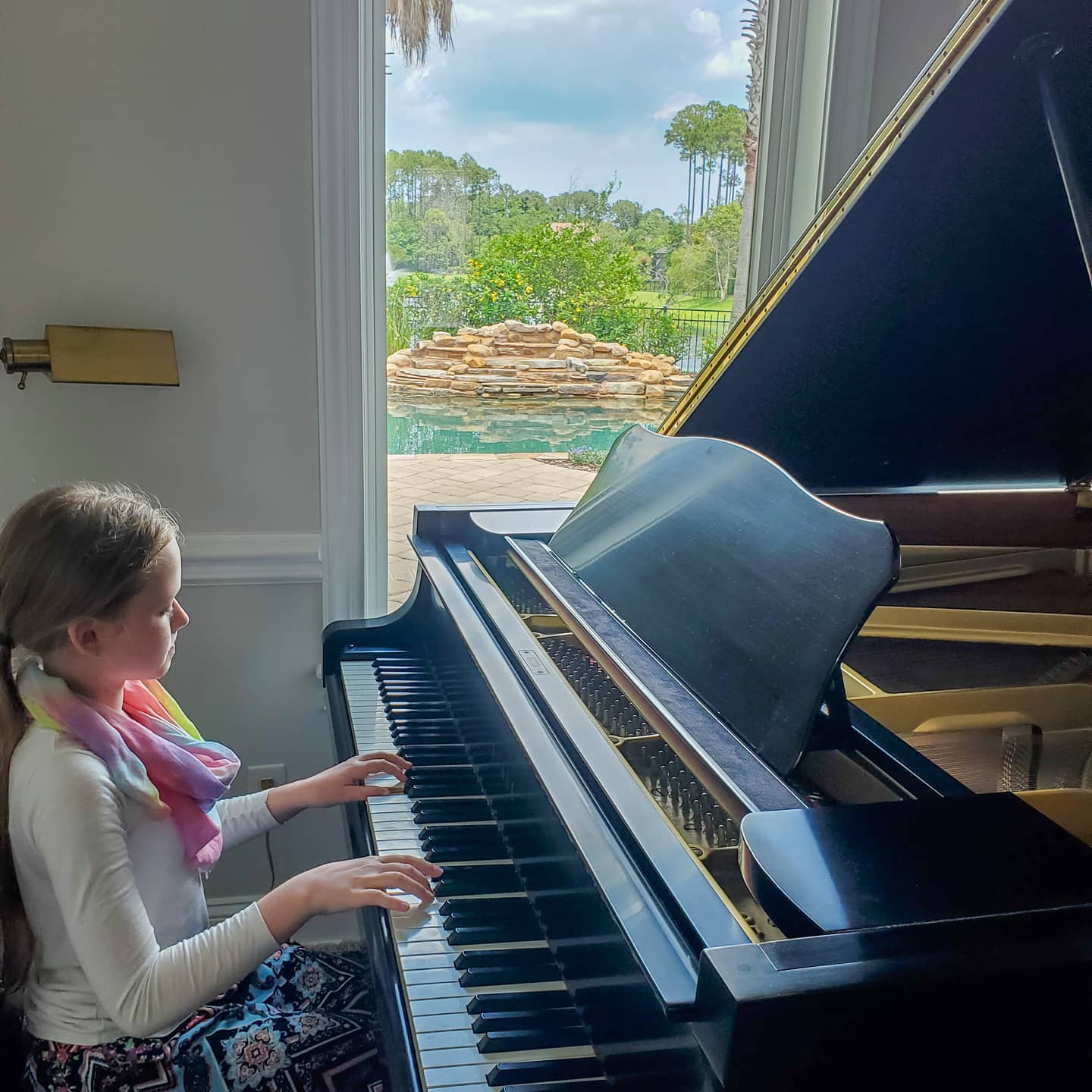 Playing Baby Piano — Summerfield, FL — Florida Piano Services. LLC