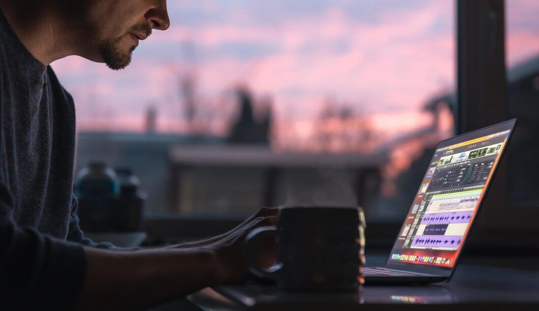 photo of a man  working for a multimedia content
