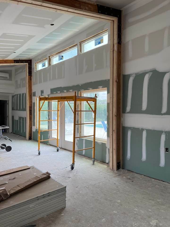 A large room with a scaffolding in the middle of it