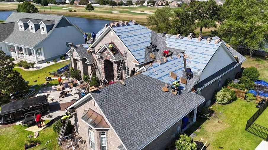 An aerial view of a house being remodeled with a new roof.