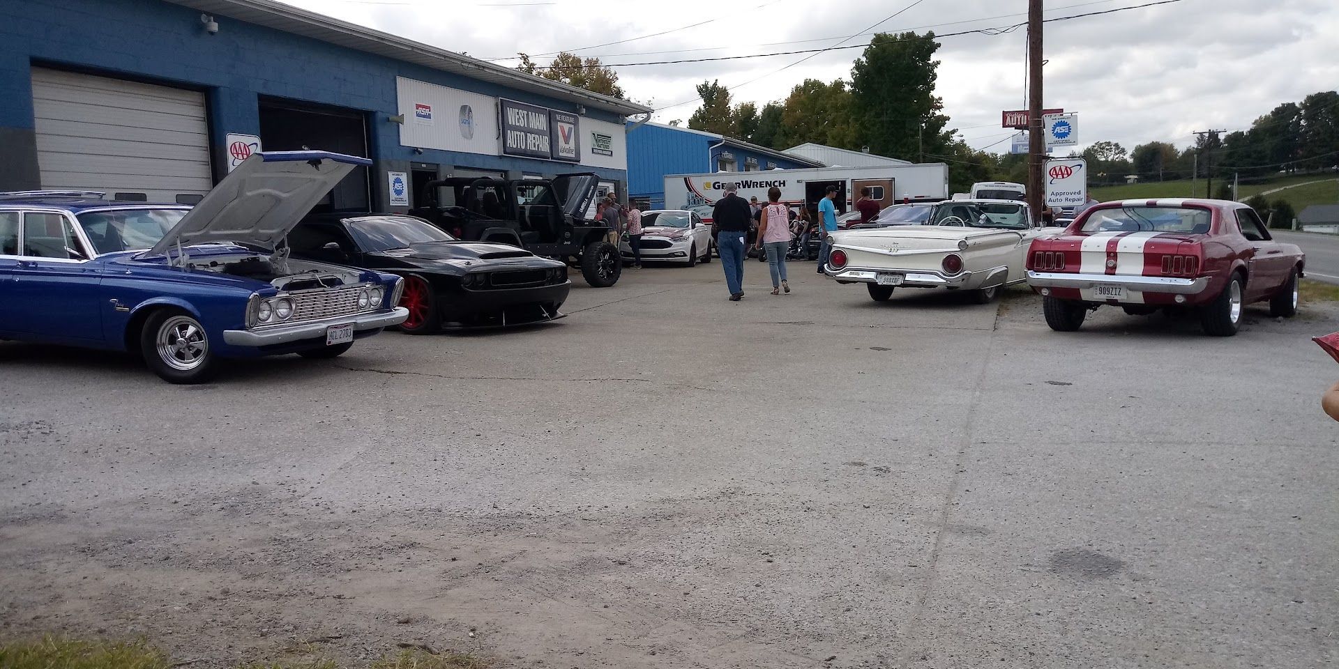 Car show at a blue building | West Main Auto Repair