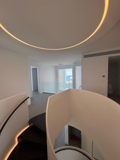 lighting on a spiral staircase— Powered By JBES In Sandgate, NSW
