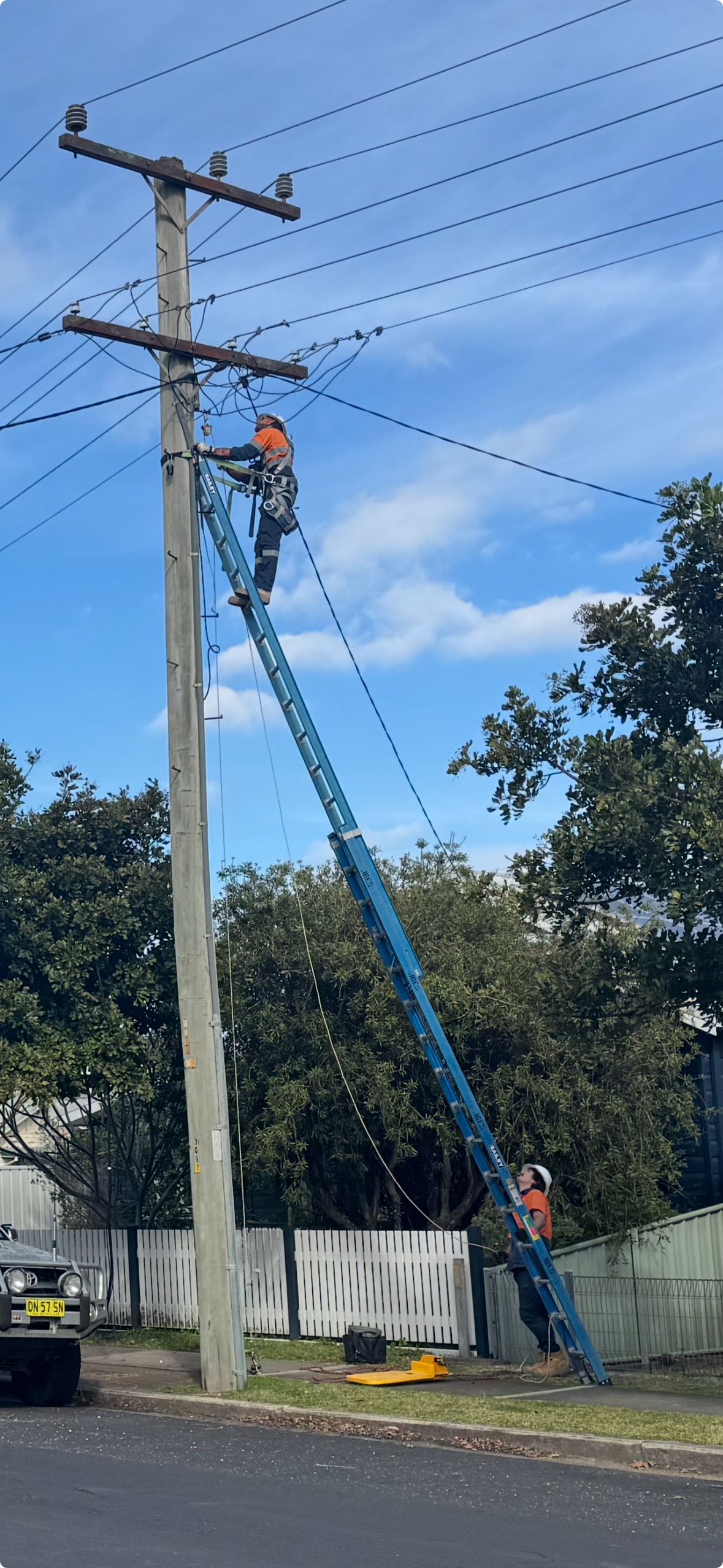 Electrician working on high voltage wiring— Powered By JBES In Sandgate, NSW