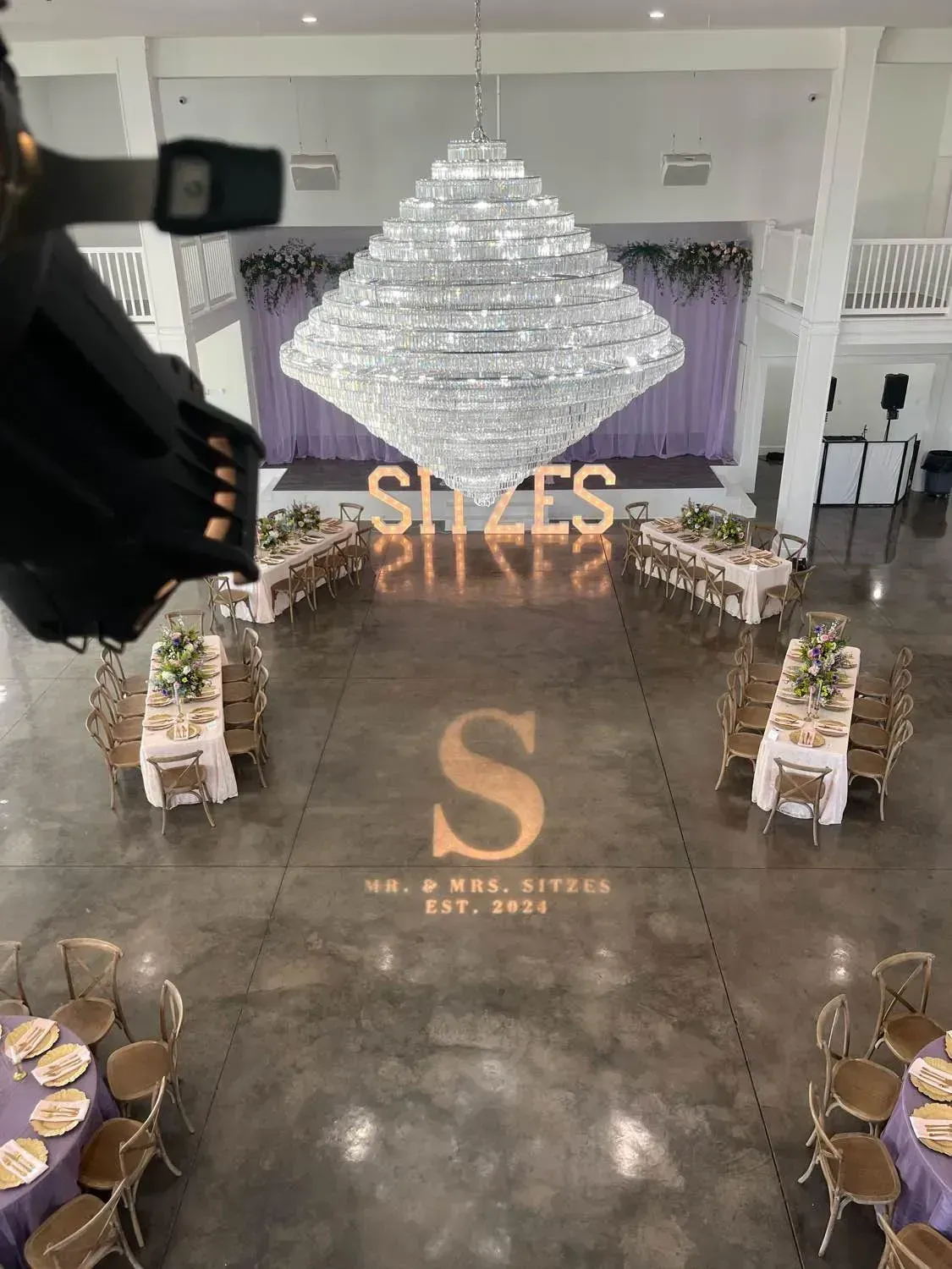 Elegant banquet hall with crystal chandelier, mirrored 