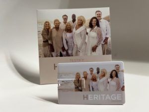 USB drive and box featuring a group photo on a beach with the word 