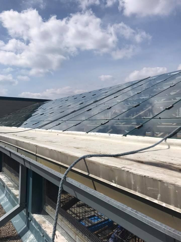 A roof with a lot of solar panels on it