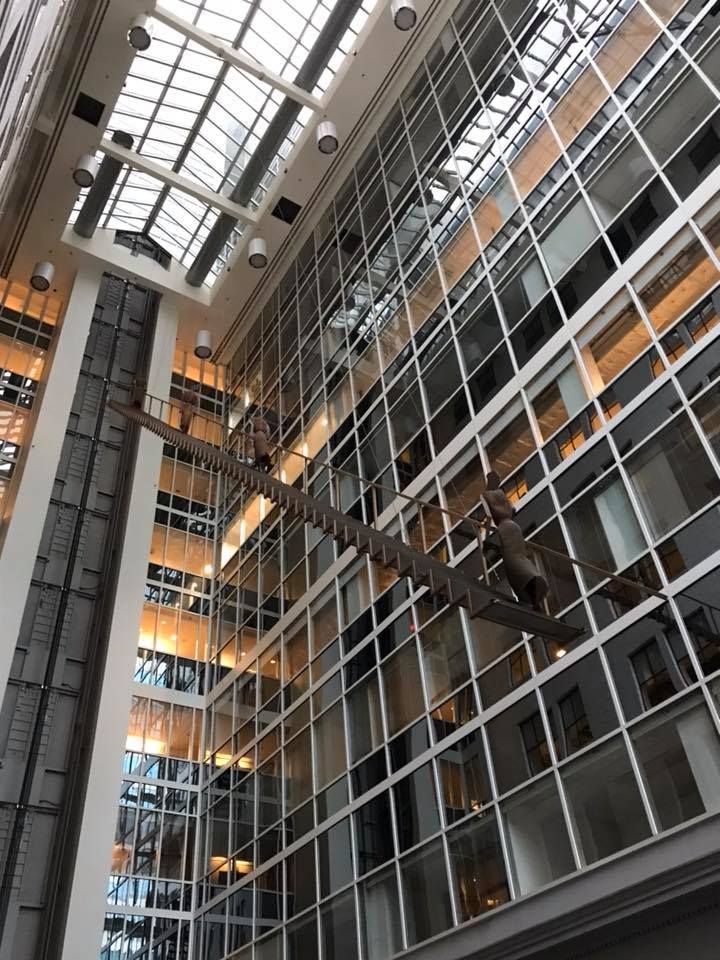 A large building with a lot of windows and stairs.