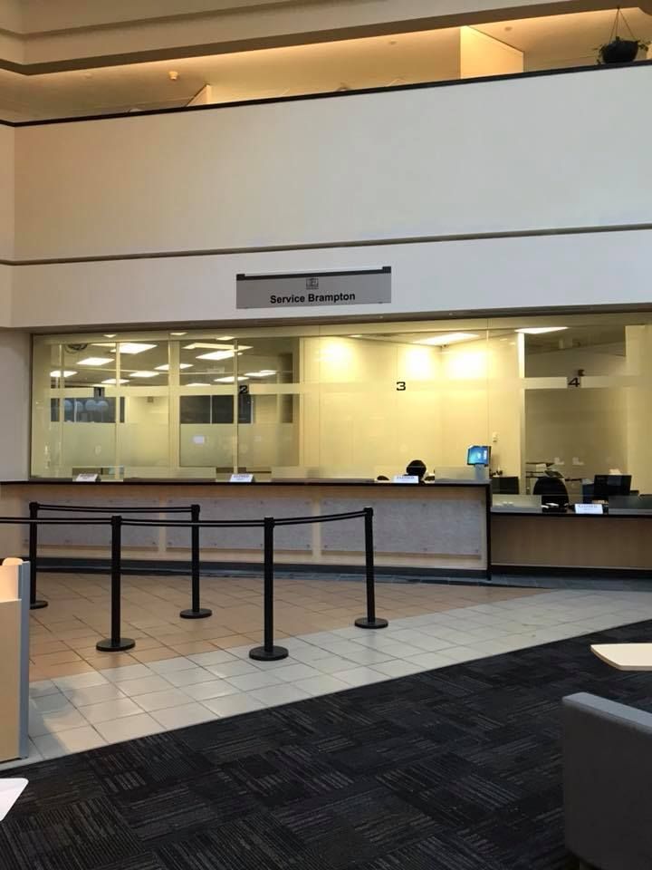 A large building with a sign on the wall that says customer service