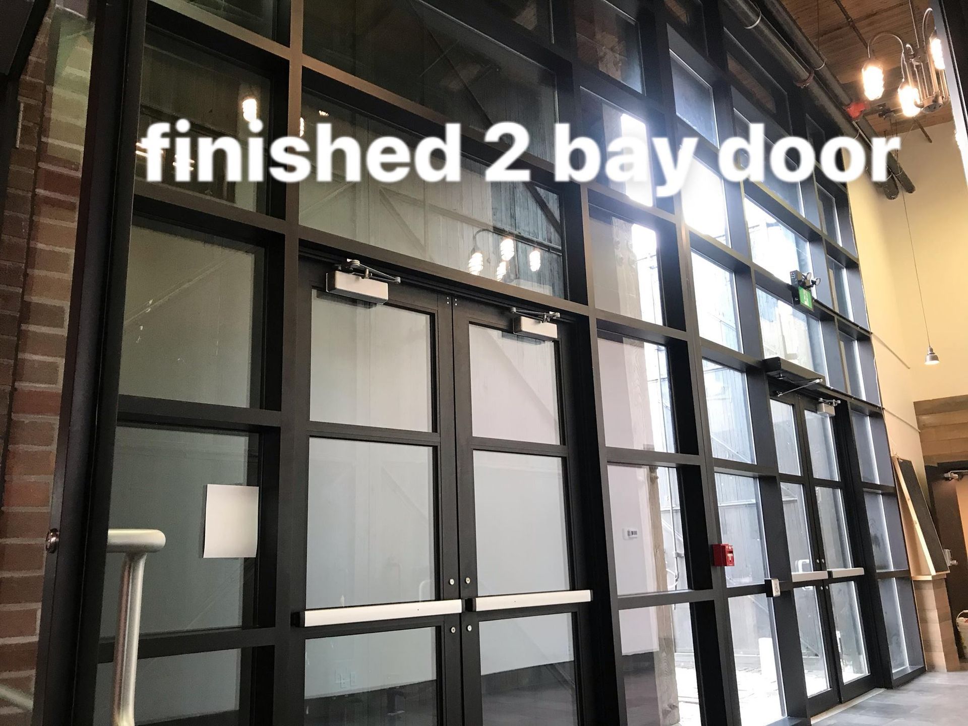 A picture of a finished 2 bay door in a building
