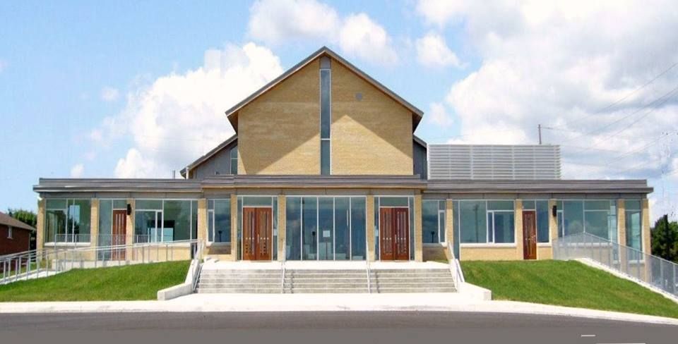 A large building with a lot of windows and doors