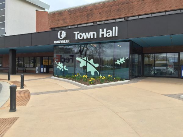 A building with a sign that says town hall on it