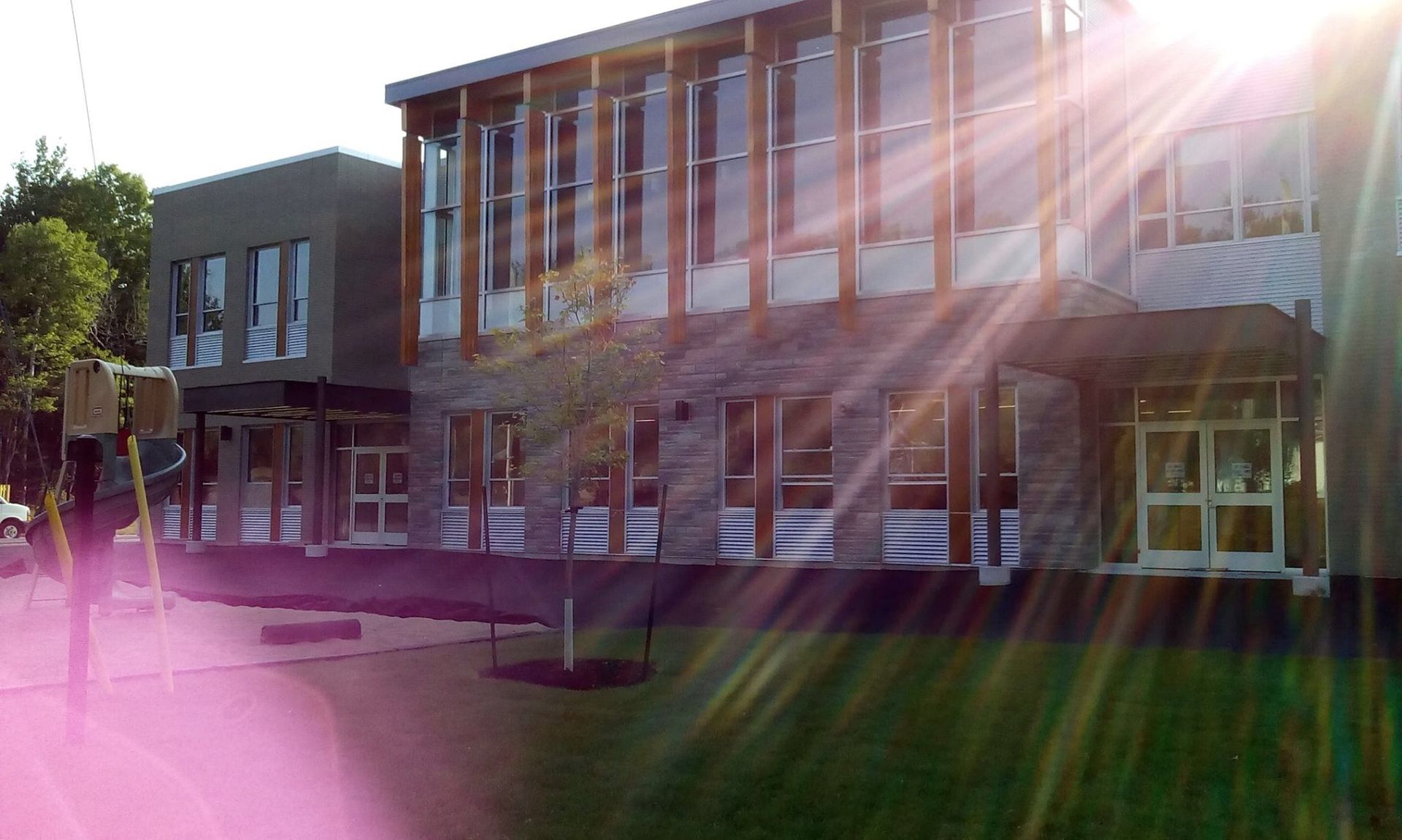 The sun is shining through the windows of a building