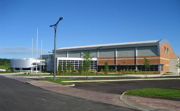 A large building with a blue sky in the background