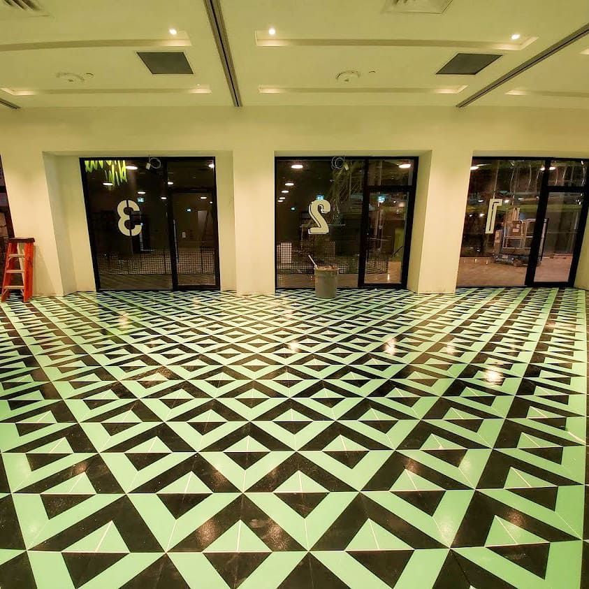 A black and white checkered floor with the number 3 on the ceiling