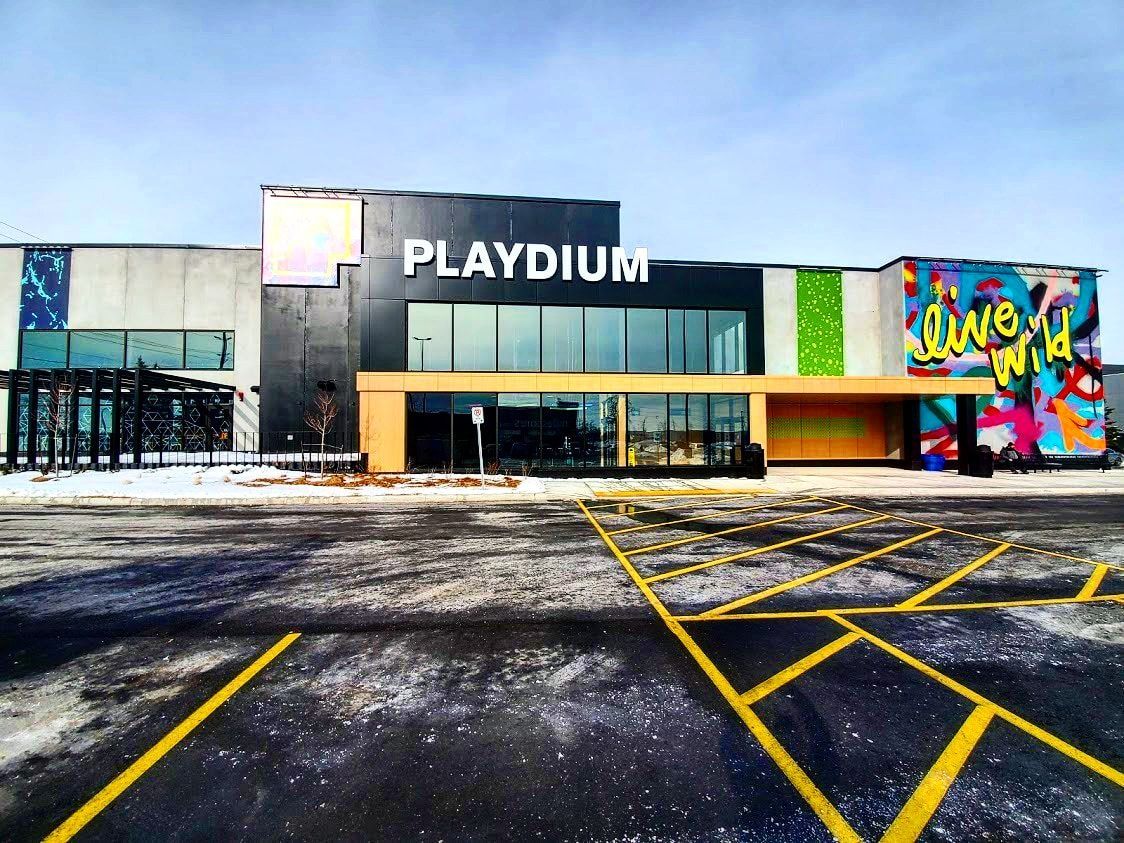 A large building with the word playdium on it