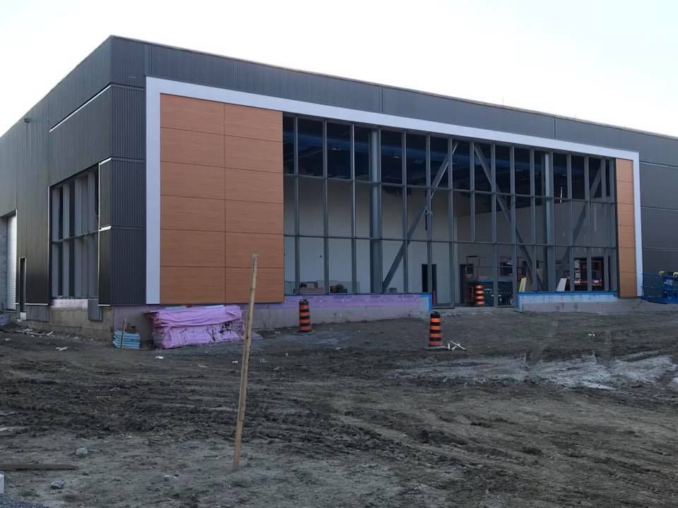 A large building under construction with a lot of windows