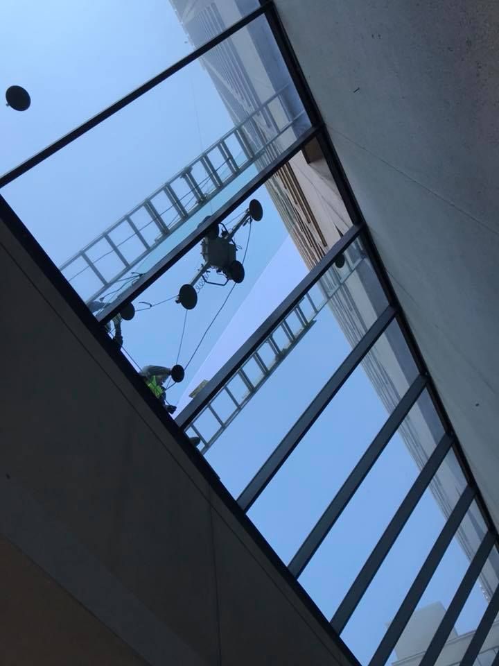 Looking up at the sky through a glass ceiling