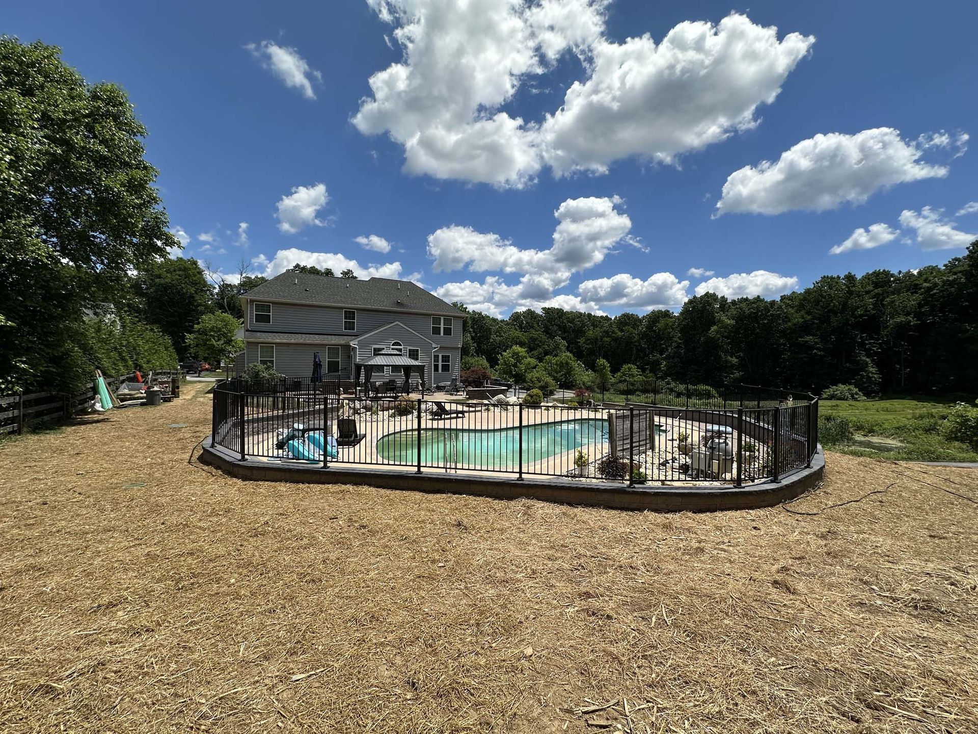 A house with a swimming pool in the backyard