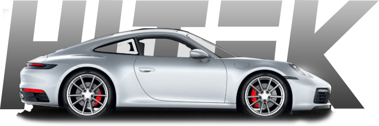 Silver Porsche sports car with red brake calipers, positioned in front of the word 