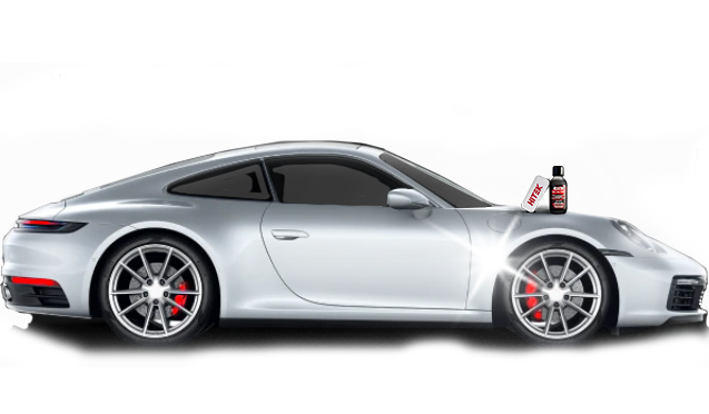Silver Porsche sports car with cleaning products on the hood, reflecting bright light, set against a white background.